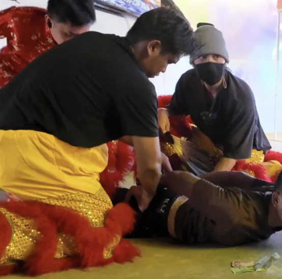 Thai police disguised as dragon arrest artefact theft suspect in Bangkok